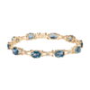 Bransoleta złota z topazami London Blue i diamentami
